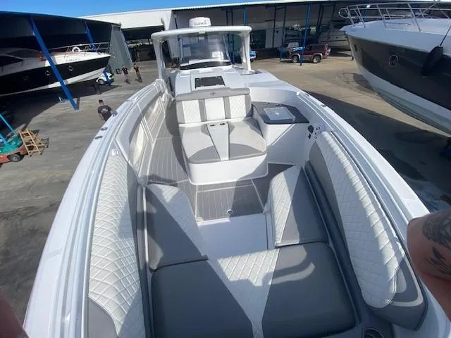 Cigarette 42 Yacht Photos Pics 2017 Cigarette 42 Huntress boat with sleek design and spacious seating in a marina setting.