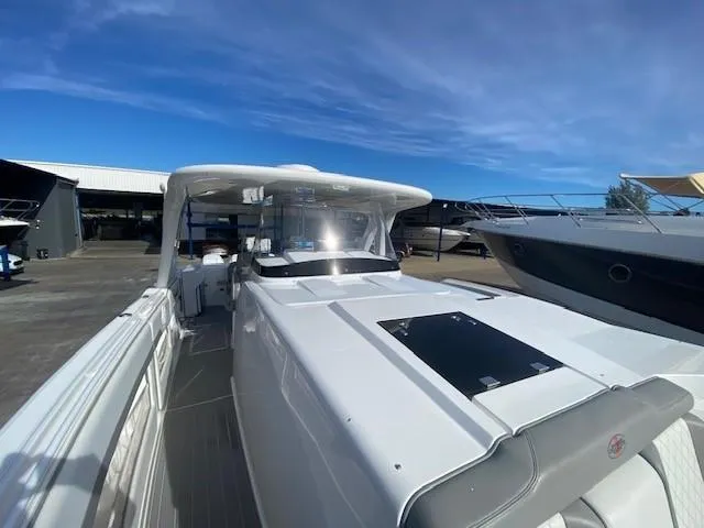 Cigarette 42 Yacht Photos Pics 2017 Cigarette 42 Huntress boat docked under clear blue sky.