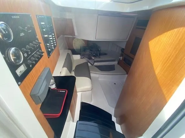 Cigarette 42 Yacht Photos Pics Interior of 2017 Cigarette 42 Huntress boat with seating and control panels.