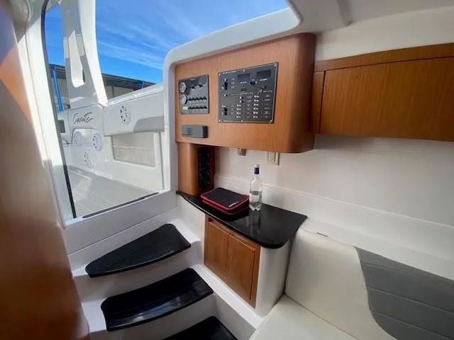 Cigarette 42 Yacht Photos Pics Interior of 2017 Cigarette 42 Huntress boat with control panel and seating area.