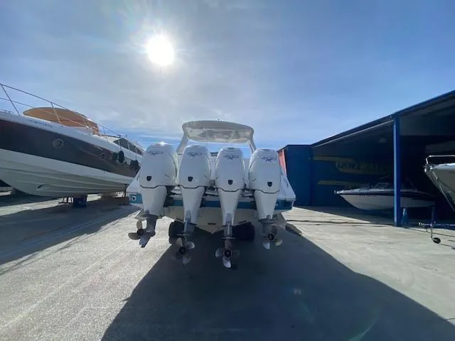 Cigarette 42 Yacht Photos Pics 2017 Cigarette 42 Huntress boat with four powerful outboard engines in a sunny marina.