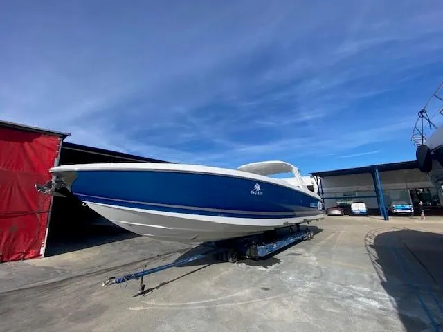 Cigarette 42 Yacht Photos Pics 2017 Cigarette 42 Huntress boat on trailer under clear blue sky.