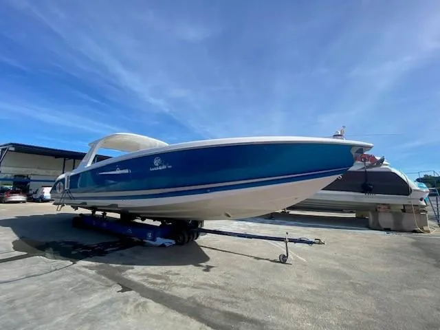 Cigarette 42 Yacht Photos Pics 2017 Cigarette 42 Huntress boat on trailer under clear blue sky.
