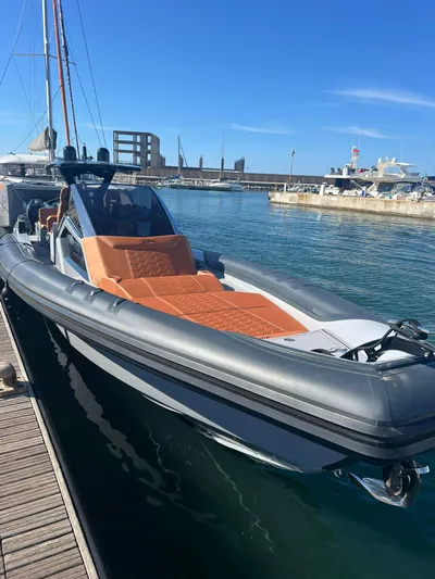  Yacht Photos Pics Modern DNA 46 boat docked at marina, 2025 model, sleek design with orange seating.