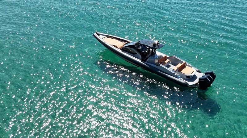  Yacht Photos Pics Modern DNA 46 boat cruising on clear turquoise water, 2025 model.