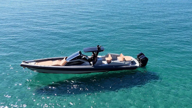  Yacht Photos Pics DNA 46 boat 2025 model cruising on clear blue water.