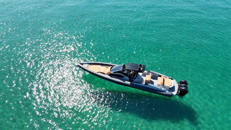  Yacht Photos Pics Aerial view of DNA 46 boat model 2025 on clear turquoise water.