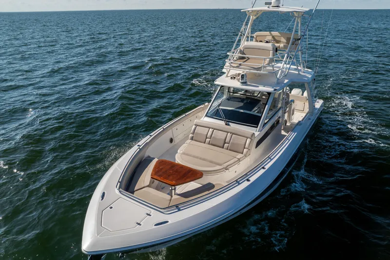 Smoke Show Yacht Photos Pics 2021 Boston Whaler 420 Outrage cruising on open water, showcasing luxury and performance.