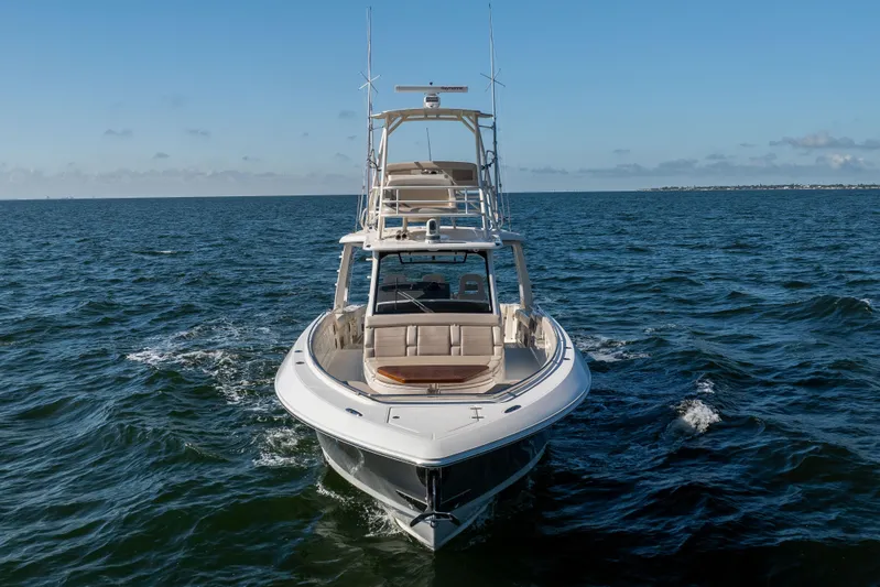 Smoke Show Yacht Photos Pics 2021 Boston Whaler 420 Outrage cruising on open water under clear skies.