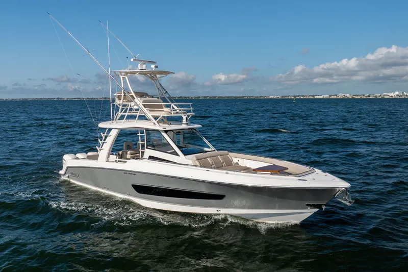 Smoke Show Yacht Photos Pics 2021 Boston Whaler 420 Outrage cruising on open water under clear skies.