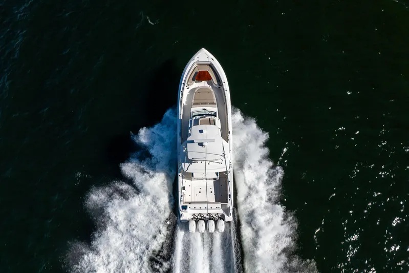 Smoke Show Yacht Photos Pics Aerial view of 2021 Boston Whaler 420 Outrage cruising on open water.
