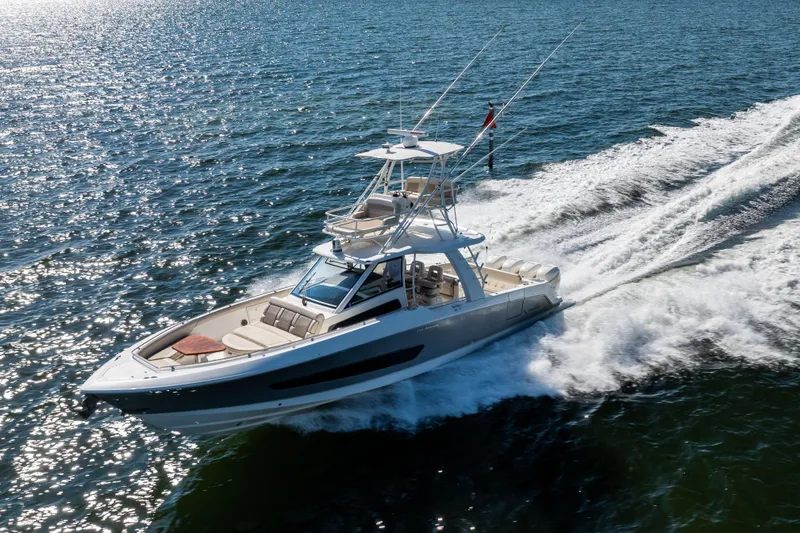 Smoke Show Yacht Photos Pics 2021 Boston Whaler 420 Outrage cruising on open water, showcasing sleek design and performance.