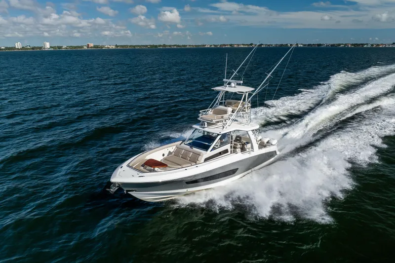 Smoke Show Yacht Photos Pics 2021 Boston Whaler 420 Outrage cruising on open water under a clear sky.