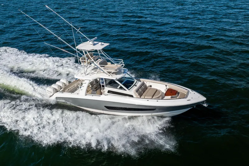 Smoke Show Yacht Photos Pics 2021 Boston Whaler 420 Outrage cruising on open water, showcasing sleek design and performance.