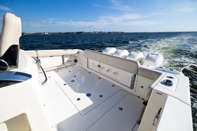 Smoke Show Yacht Photos Pics 2021 Boston Whaler 420 Outrage boat cruising on open water, showcasing spacious deck.