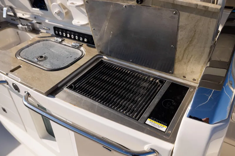 Smoke Show Yacht Photos Pics Outdoor kitchen on 2021 Boston Whaler 420 Outrage with grill and sink.