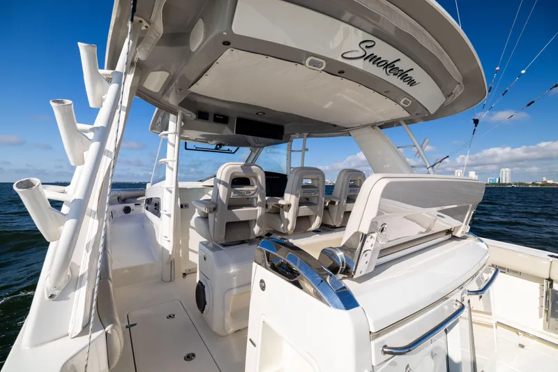 Smoke Show Yacht Photos Pics 2021 Boston Whaler 420 Outrage boat interior with seating and ocean view.