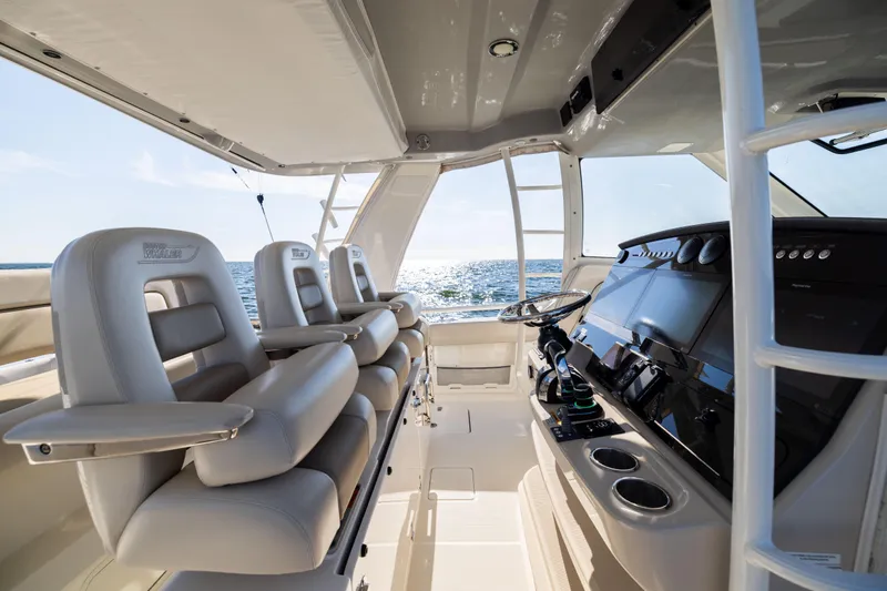 Smoke Show Yacht Photos Pics Interior of 2021 Boston Whaler 420 Outrage boat with luxurious seating and modern controls.