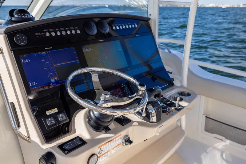 Smoke Show Yacht Photos Pics 2021 Boston Whaler 420 Outrage helm with advanced navigation displays and controls.