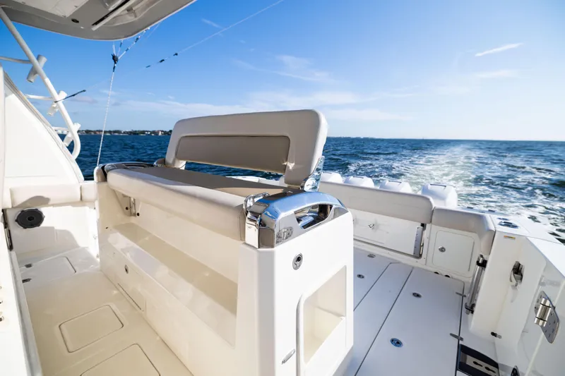 Smoke Show Yacht Photos Pics 2021 Boston Whaler 420 Outrage boat interior with ocean view and seating area.