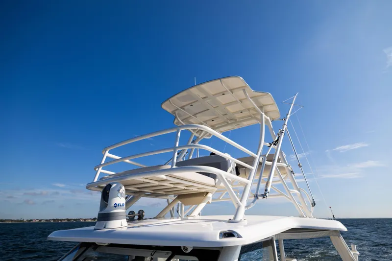 Smoke Show Yacht Photos Pics Boston Whaler 420 Outrage 2021 boat tower against clear blue sky.