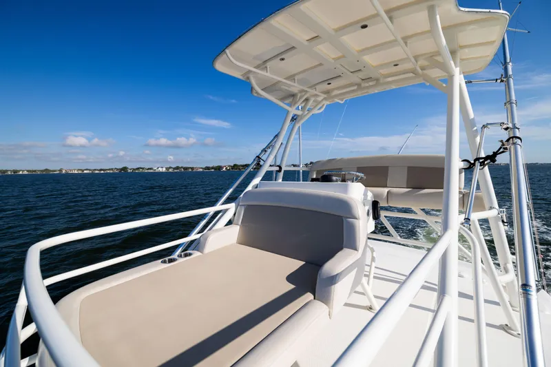 Smoke Show Yacht Photos Pics 2021 Boston Whaler 420 Outrage boat cruising on open water under clear blue skies.