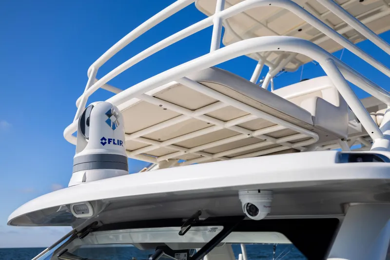 Smoke Show Yacht Photos Pics 2021 Boston Whaler 420 Outrage with FLIR camera, ocean backdrop, clear sky.