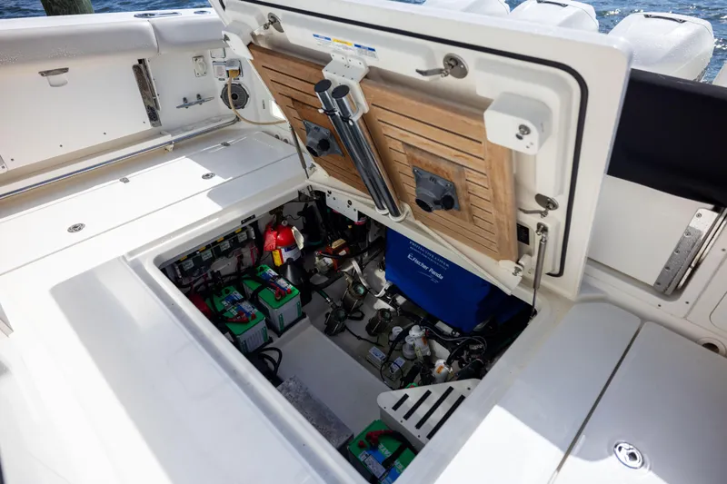 Smoke Show Yacht Photos Pics 2021 Boston Whaler 420 Outrage engine compartment with batteries and equipment.