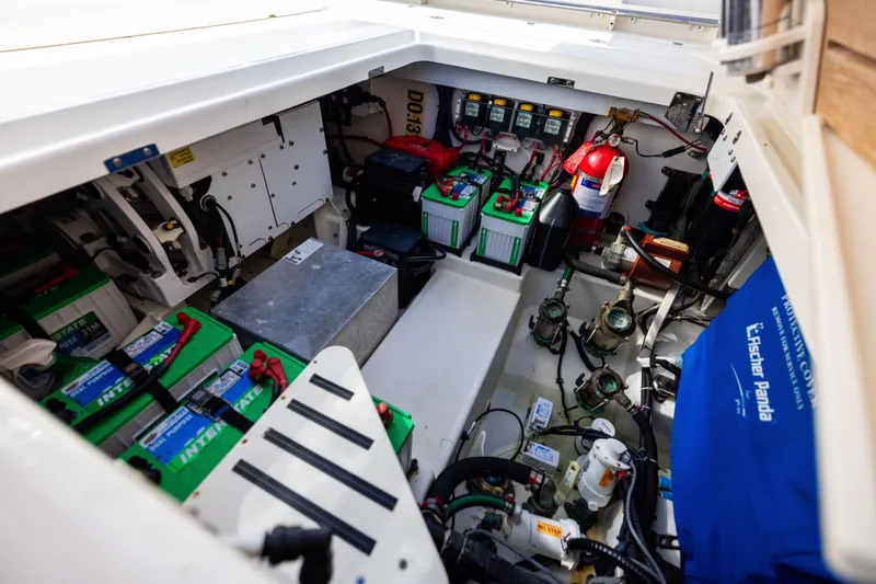 Smoke Show Yacht Photos Pics Engine compartment of 2021 Boston Whaler 420 Outrage with batteries and equipment.