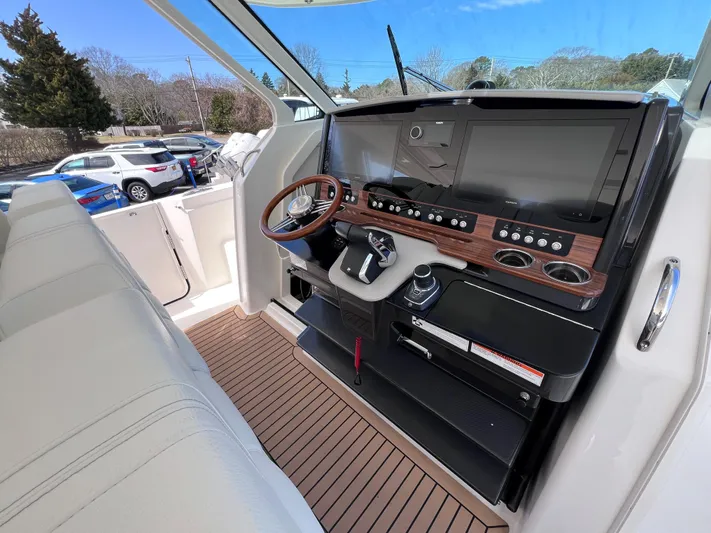  Yacht Photos Pics 2023 Tiara Yachts 38 LS helm with modern controls and sleek design.