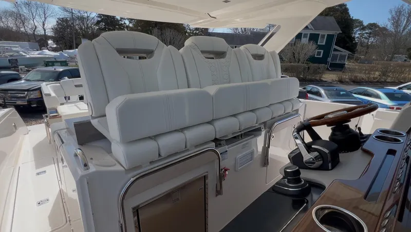 Yacht Photos Pics 2023 Tiara Yachts 38 LS interior with luxurious seating and modern helm controls.