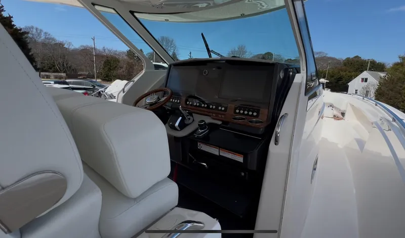  Yacht Photos Pics 2023 Tiara Yachts 38 LS helm with modern controls and luxurious seating.