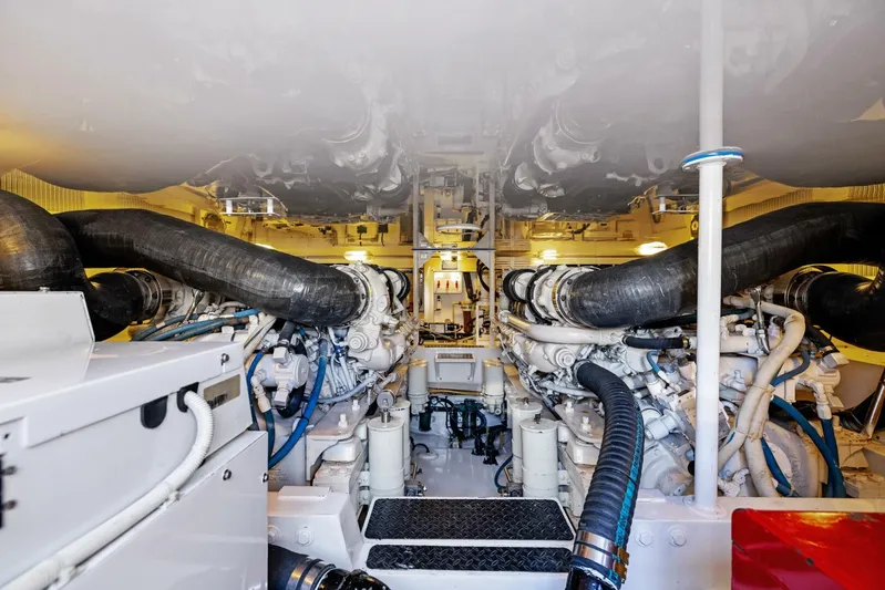 Tomaso 5 Yacht Photos Pics Engine room of 2004 Viking 52 Convertible yacht, showcasing dual engines and mechanical systems.