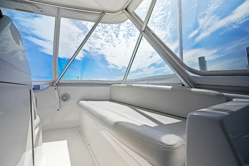 Tomaso 5 Yacht Photos Pics Interior of 2004 Viking 52 Convertible yacht with panoramic windows and seating.