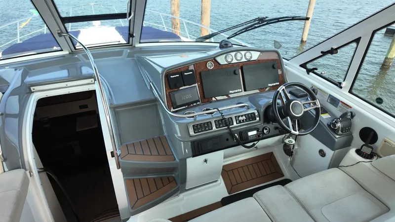 Royal Zenith Yacht Photos Pics 2013 Formula 45 Yacht helm with modern navigation equipment and luxurious seating.