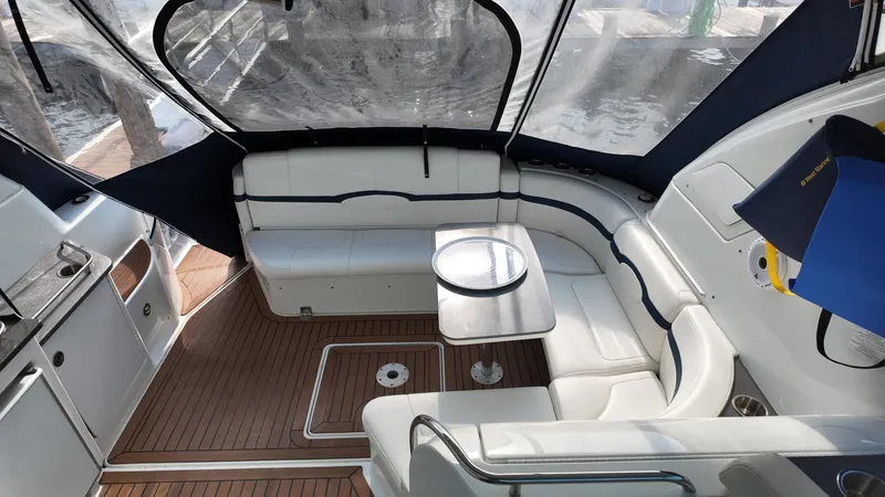 Royal Zenith Yacht Photos Pics Luxurious interior of 2013 Formula 45 Yacht with white seating and wooden flooring.