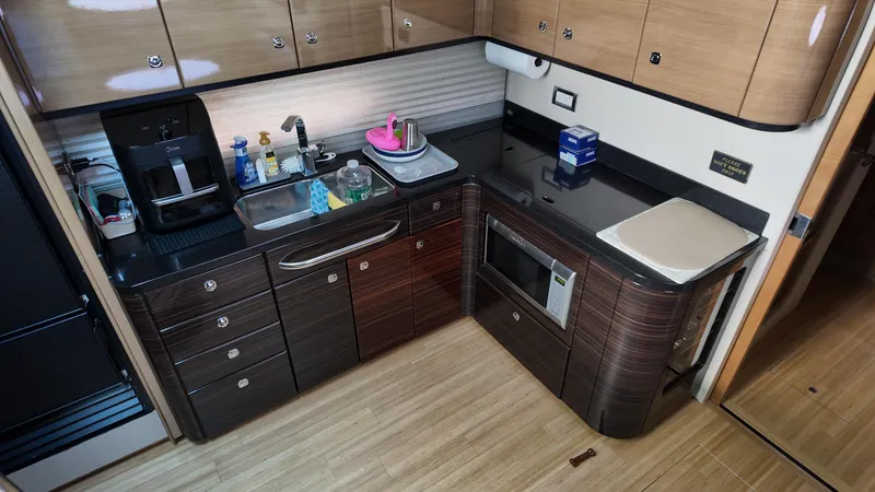 Royal Zenith Yacht Photos Pics Modern kitchen in a 2013 Formula 45 Yacht with sleek cabinetry and appliances.