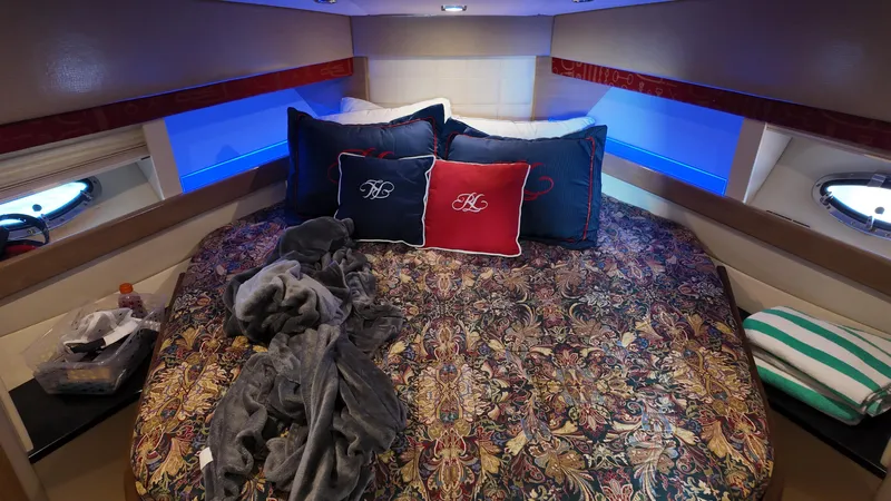 Royal Zenith Yacht Photos Pics Luxurious bedroom interior of 2013 Formula 45 Yacht with patterned bedding and ambient lighting.