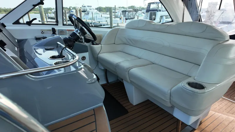 Royal Zenith Yacht Photos Pics Luxurious interior of a 2013 Formula 45 Yacht with plush seating and sleek controls.