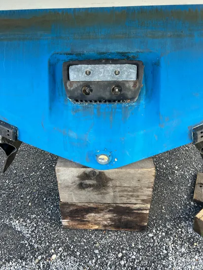 Royal Zenith Yacht Photos Pics 2013 Formula 45 Yacht stern on wooden blocks, blue hull, gravel ground.