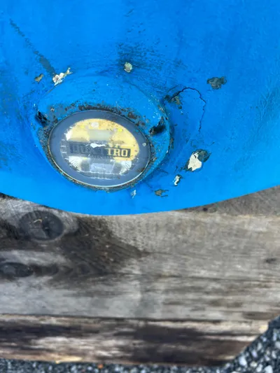 Royal Zenith Yacht Photos Pics Close-up of a weathered blue surface with a round gauge on a Formula 45 Yacht.
