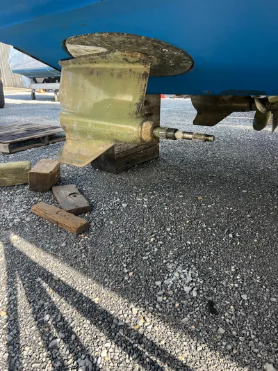 Royal Zenith Yacht Photos Pics 2013 Formula 45 Yacht propeller shaft and rudder on gravel surface.