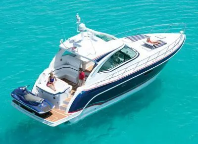 Royal Zenith Yacht Photos Pics 2013 Formula 45 Yacht cruising on clear turquoise waters with passengers relaxing.