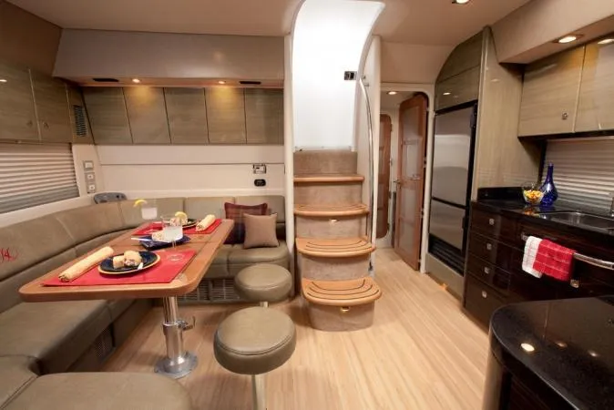 Royal Zenith Yacht Photos Pics Luxurious interior of a 2013 Formula 45 Yacht with dining area and modern kitchen.