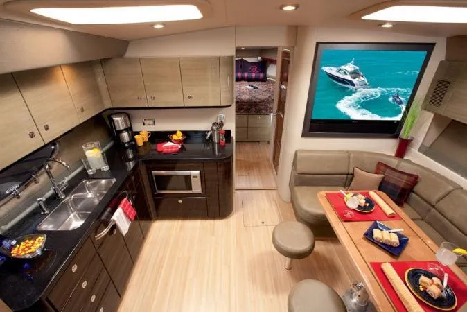 Royal Zenith Yacht Photos Pics Luxurious interior of 2013 Formula 45 Yacht with modern kitchen and dining area.