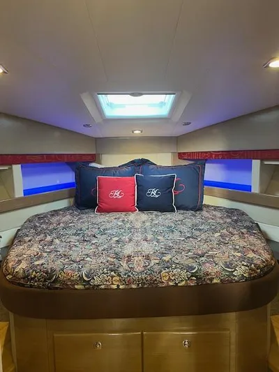 Royal Zenith Yacht Photos Pics Luxurious 2013 Formula 45 Yacht cabin with elegant bedding and ambient lighting.