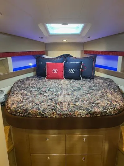 Royal Zenith Yacht Photos Pics Luxurious bedroom interior of 2013 Formula 45 Yacht with patterned bedding and decorative pillows.