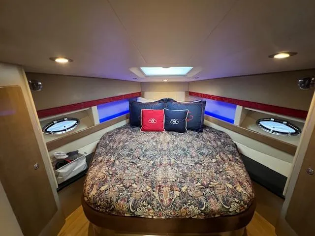 Royal Zenith Yacht Photos Pics Luxurious 2013 Formula 45 Yacht cabin with elegant bedding and ambient lighting.