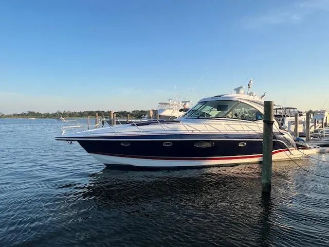 Royal Zenith Yacht Photos Pics 2013 Formula 45 Yacht docked on calm water under clear blue sky.
