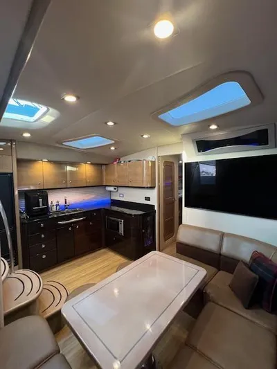 Royal Zenith Yacht Photos Pics Interior of 2013 Formula 45 Yacht with modern kitchen and seating area.